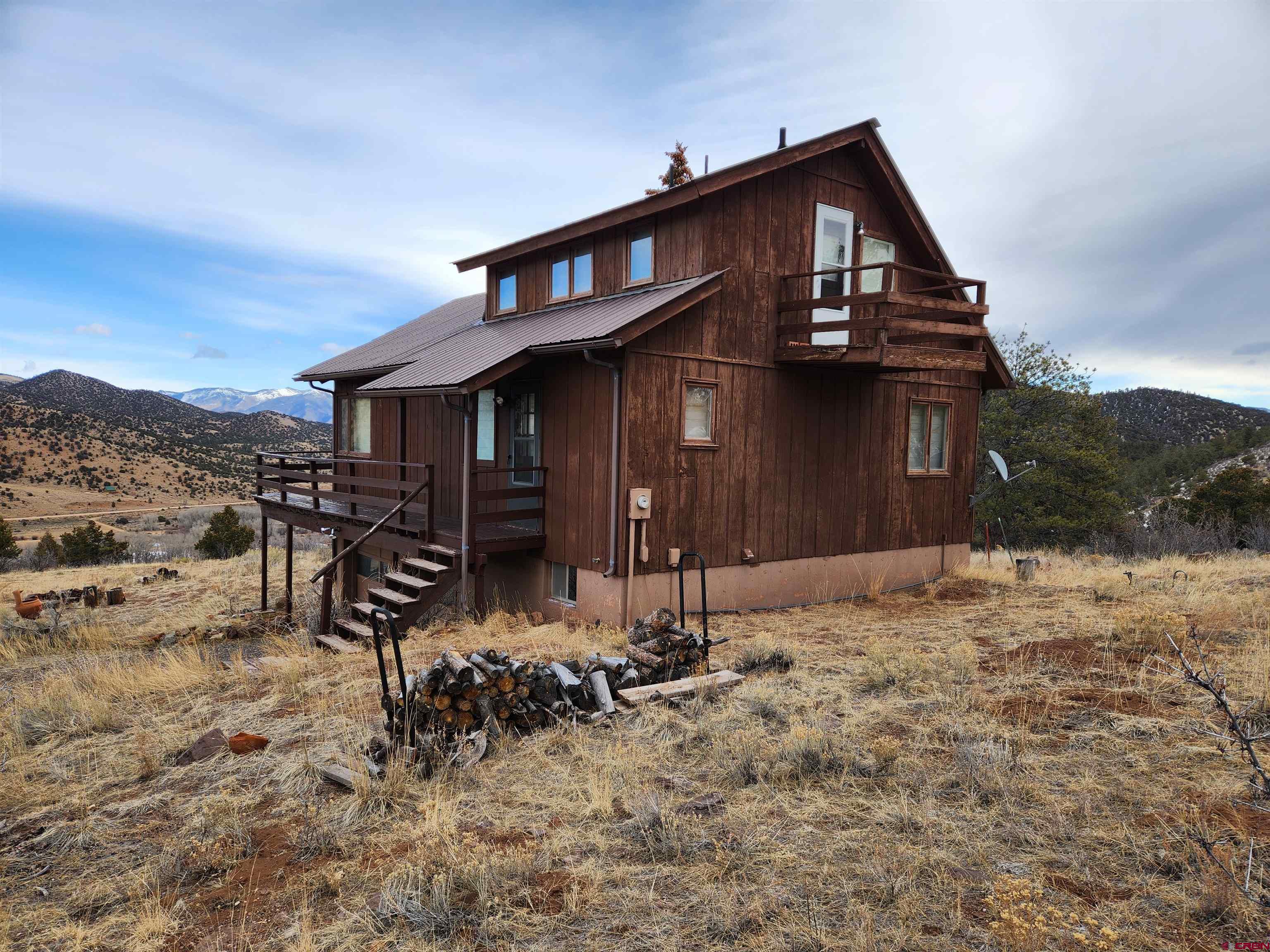 Tbd County Rd LL56 Villa Grove, CO 81155 - Photo 3 of 24 a front view of a house with large trees