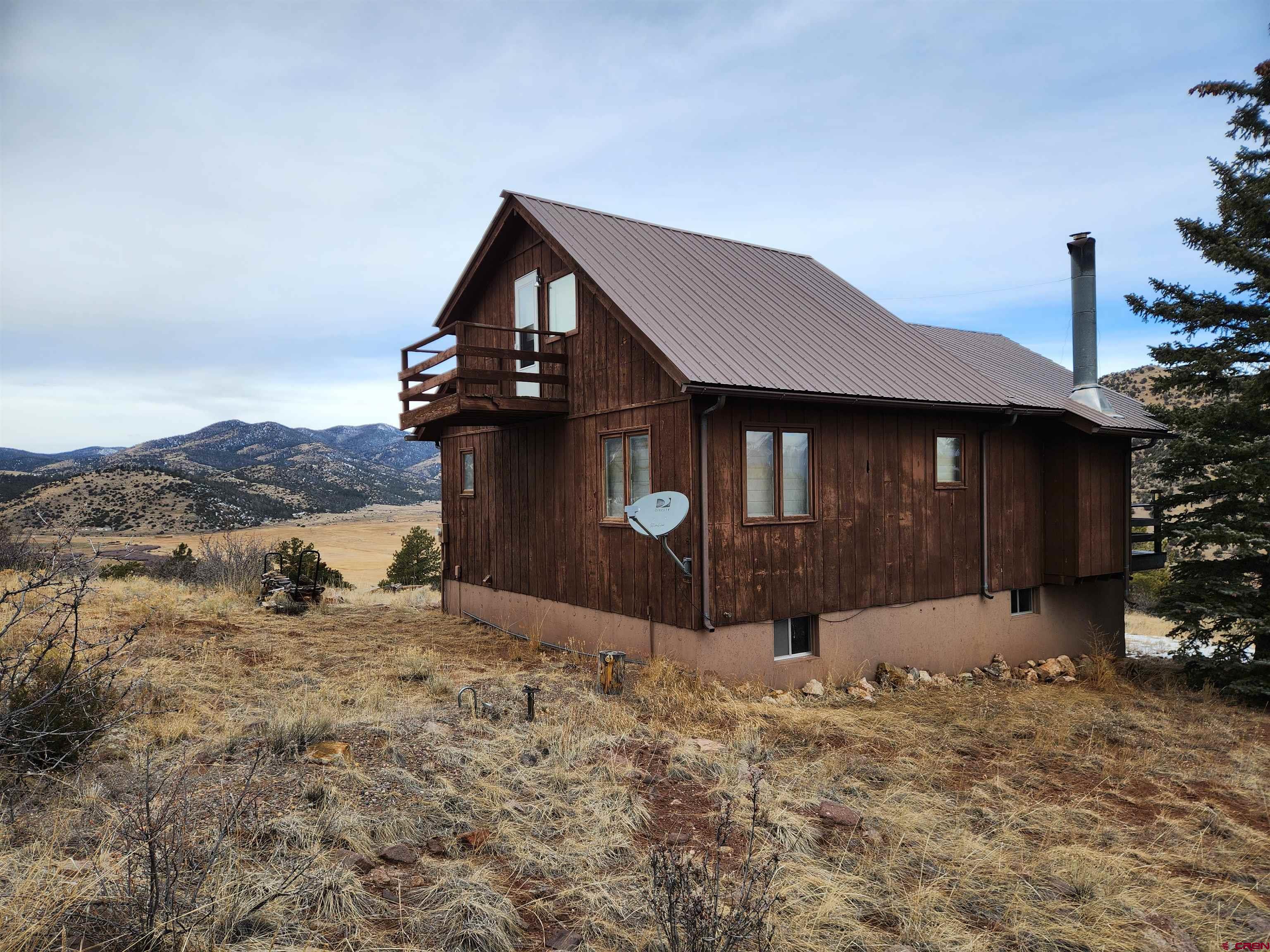 Tbd County Rd LL56 Villa Grove, CO 81155 - Photo 4 of 24 a front view of a house with a yard