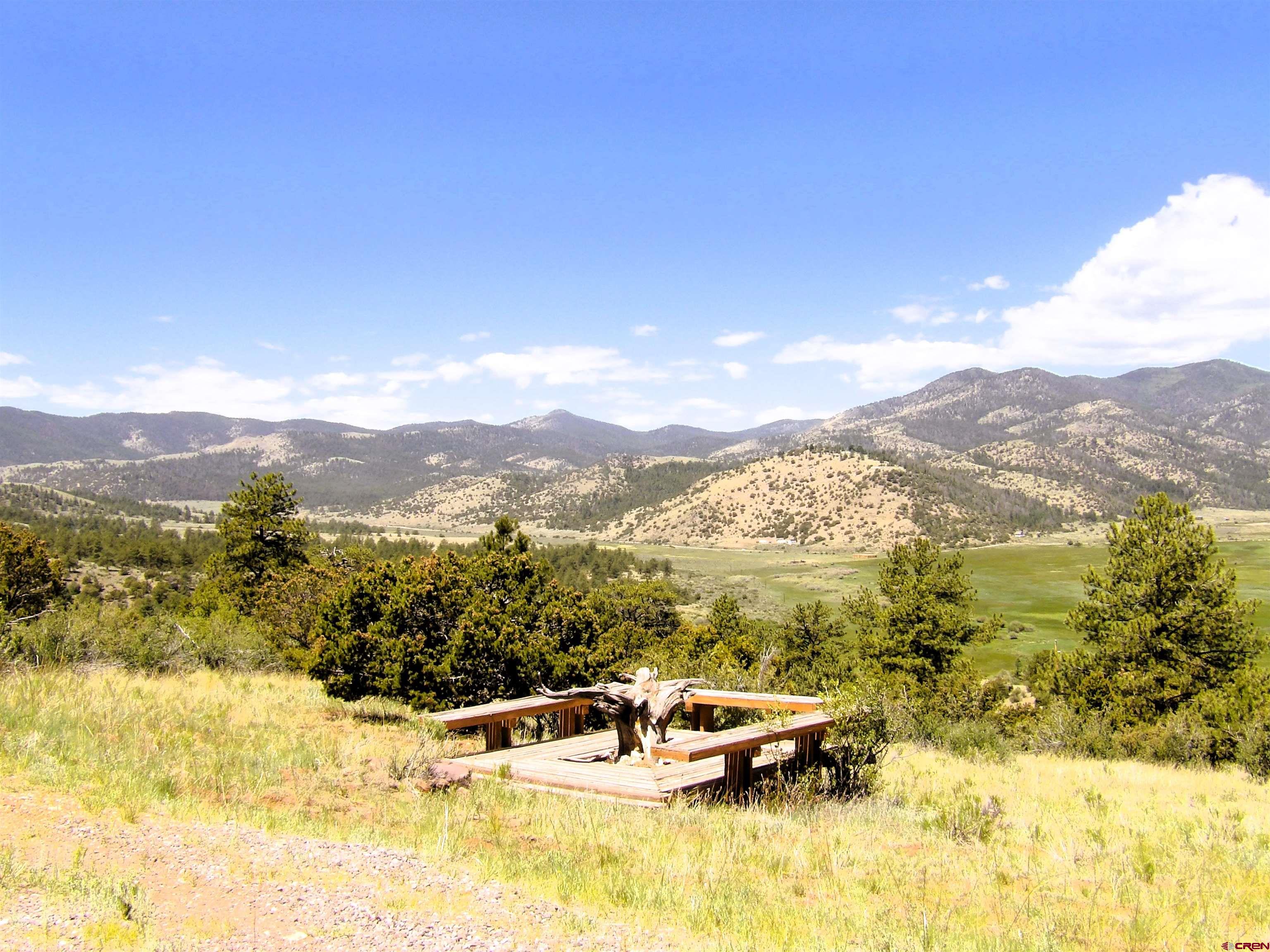 Tbd County Rd LL56 Villa Grove, CO 81155 - Photo 6 of 24 a view of a lake with a mountain