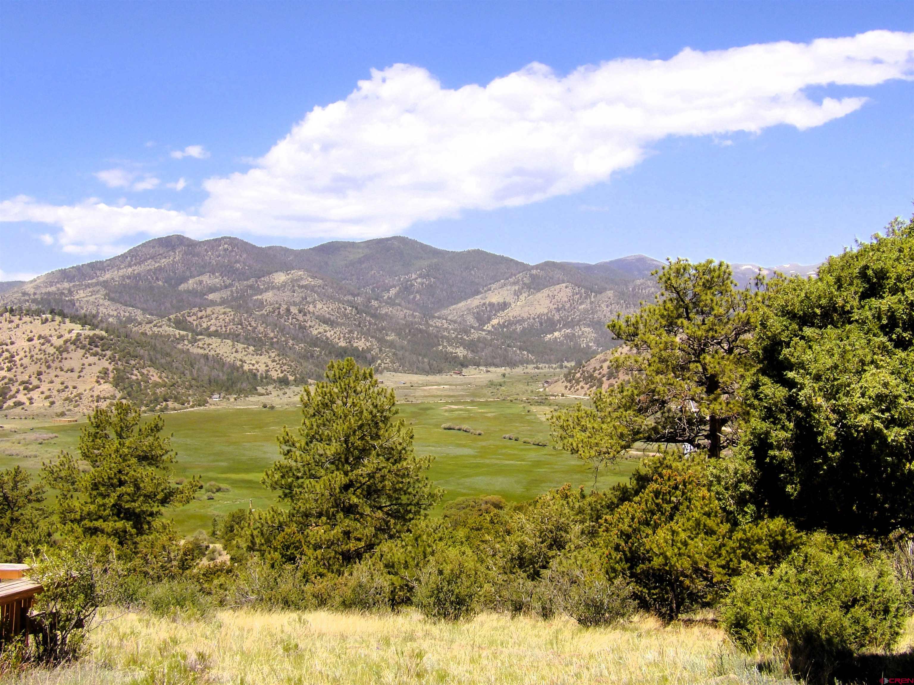Tbd County Rd LL56 Villa Grove, CO 81155 - Photo 7 of 24 a view of a lake with mountains in the background