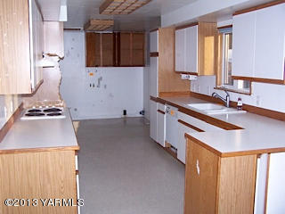 3900 Progressive Road Wapato, WA 98951 - Photo 7 of 14 a kitchen with a sink and a stove top oven