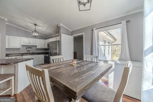 a bedroom with furniture and a chandelier
