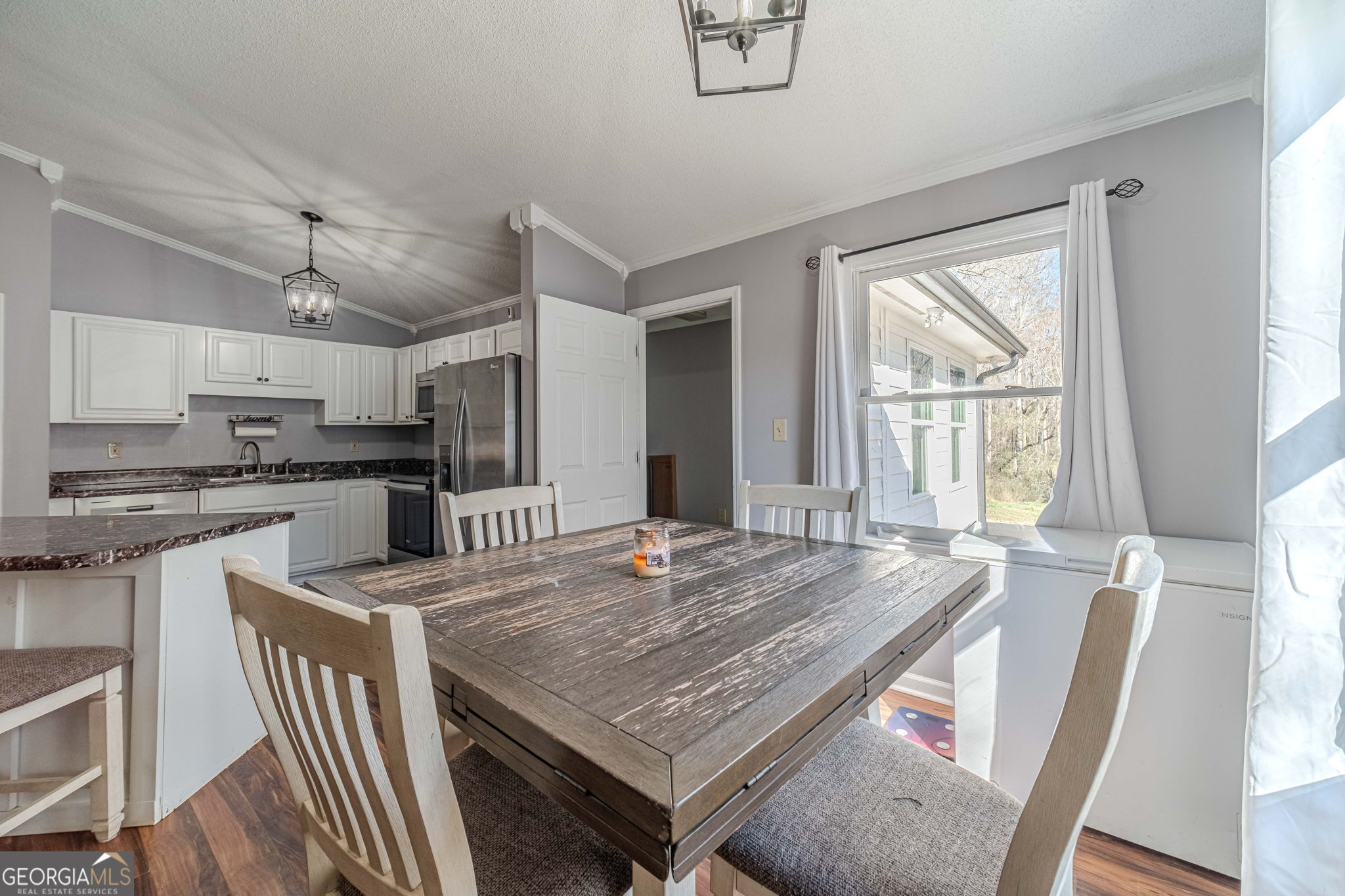 2811 High Shoals Road Good Hope, GA 30641 - Photo 13 of 37 a outdoor kitchen with kitchen island a large window a sink and appliances