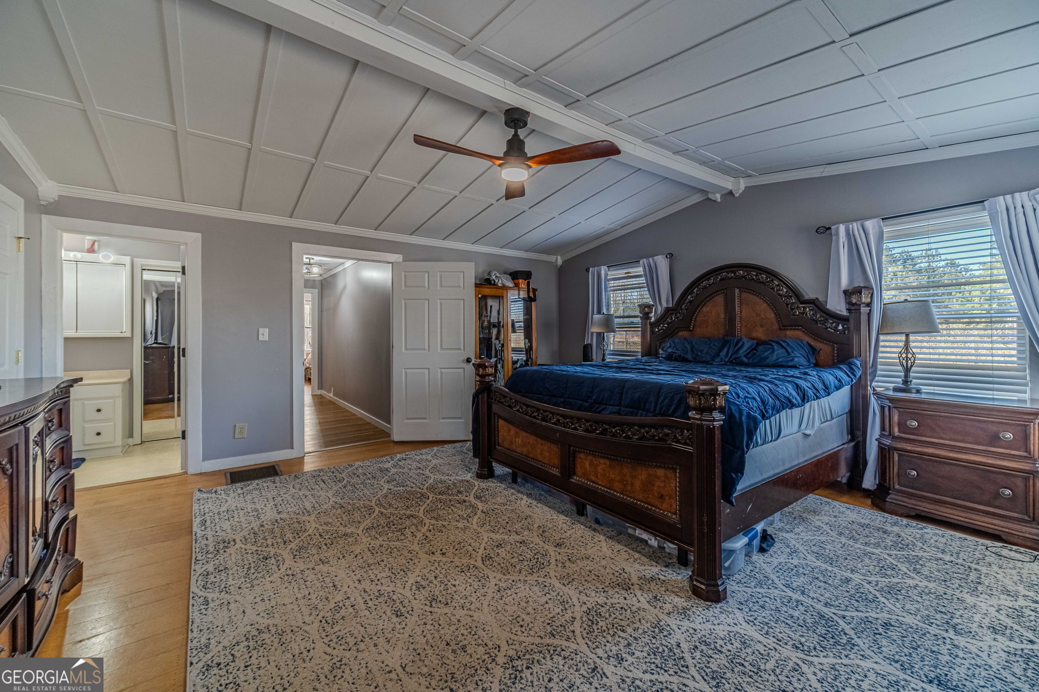 2811 High Shoals Road Good Hope, GA 30641 - Photo 14 of 37 a bedroom with furniture and a chandelier