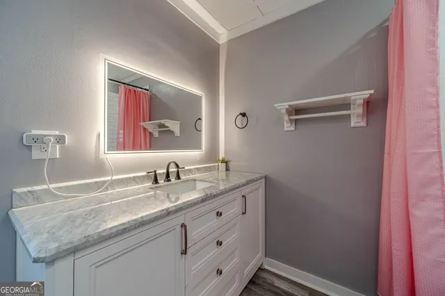 a bathroom with a bathtub and shower