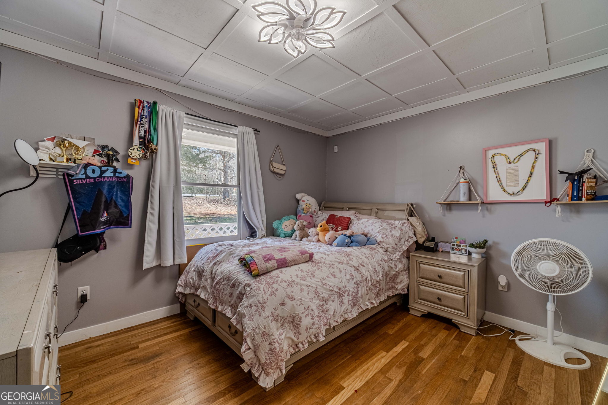 2811 High Shoals Road Good Hope, GA 30641 - Photo 21 of 37 a bedroom with a bed and a chandelier