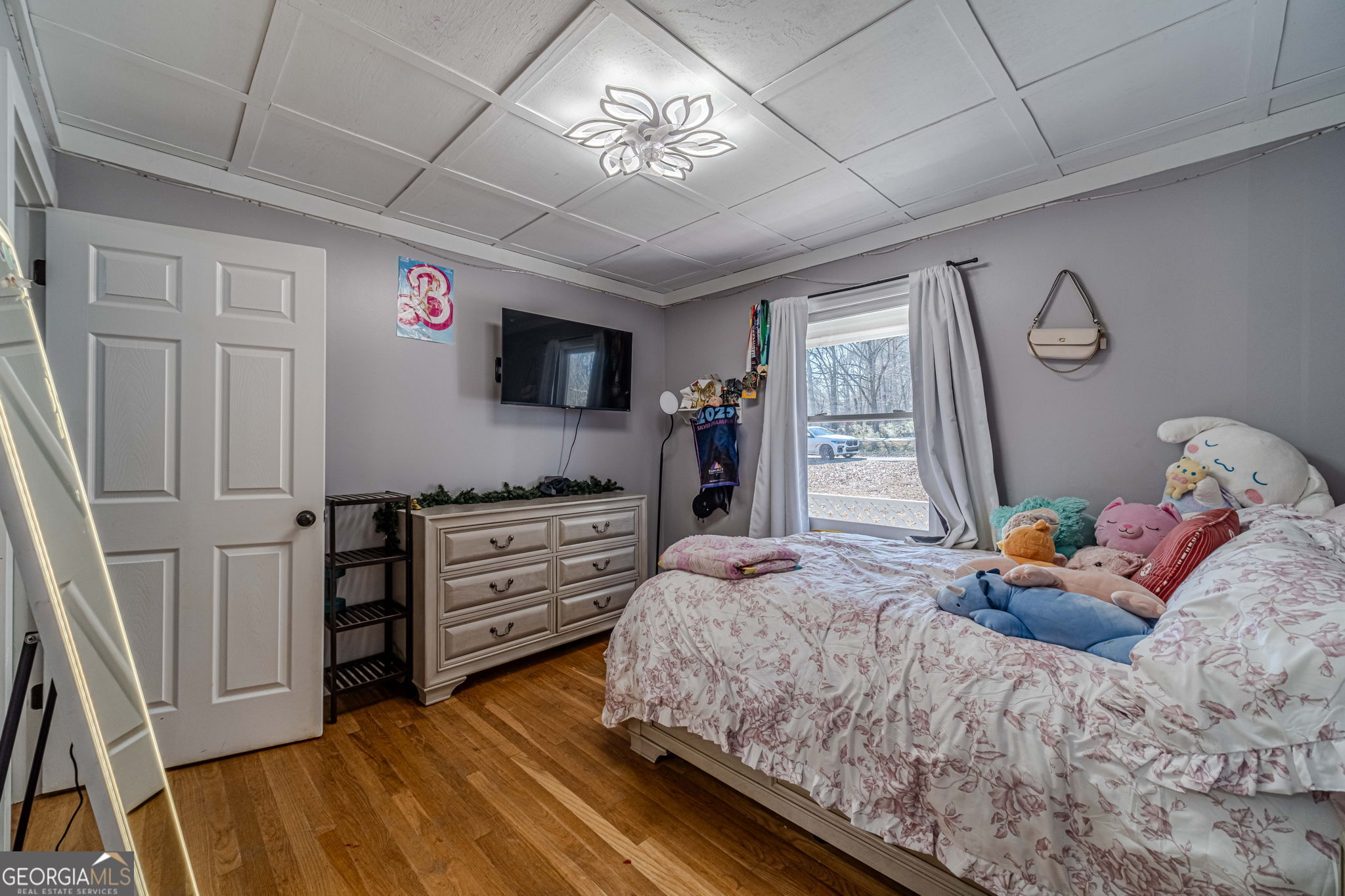2811 High Shoals Road Good Hope, GA 30641 - Photo 22 of 37 a bedroom with a bed and a flat tv screen on dresser