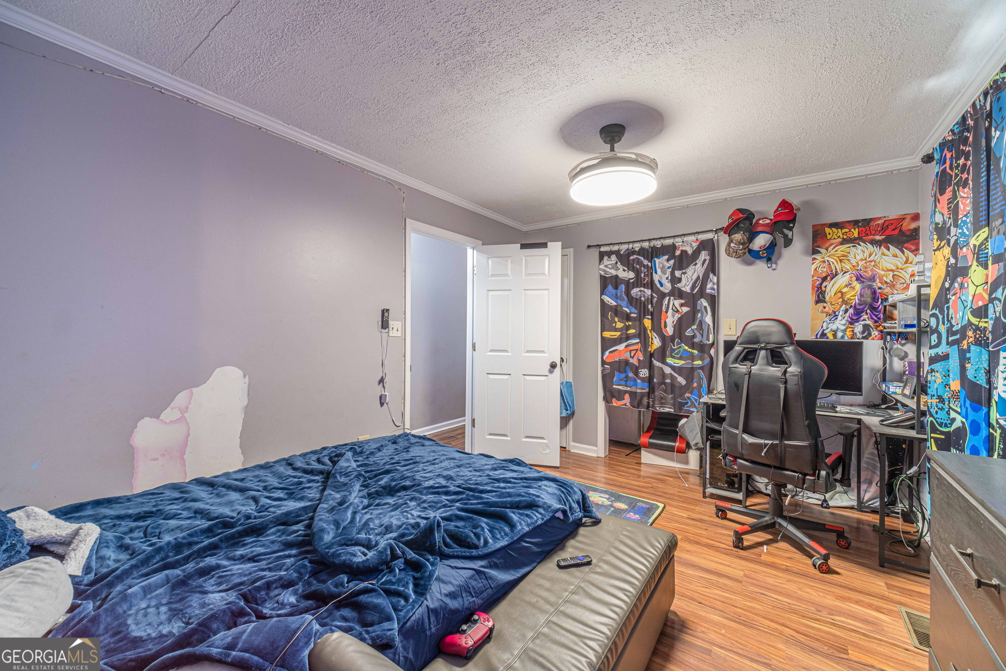 2811 High Shoals Road Good Hope, GA 30641 - Photo 30 of 37 a bedroom with bed and a wooden floor