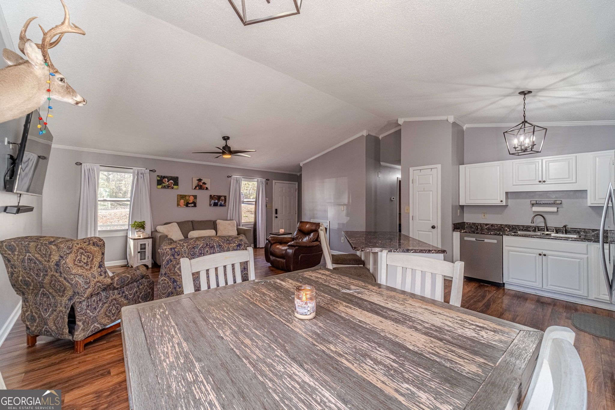 2811 High Shoals Road Good Hope, GA 30641 - Photo 6 of 37 a living room with furniture and a chandelier