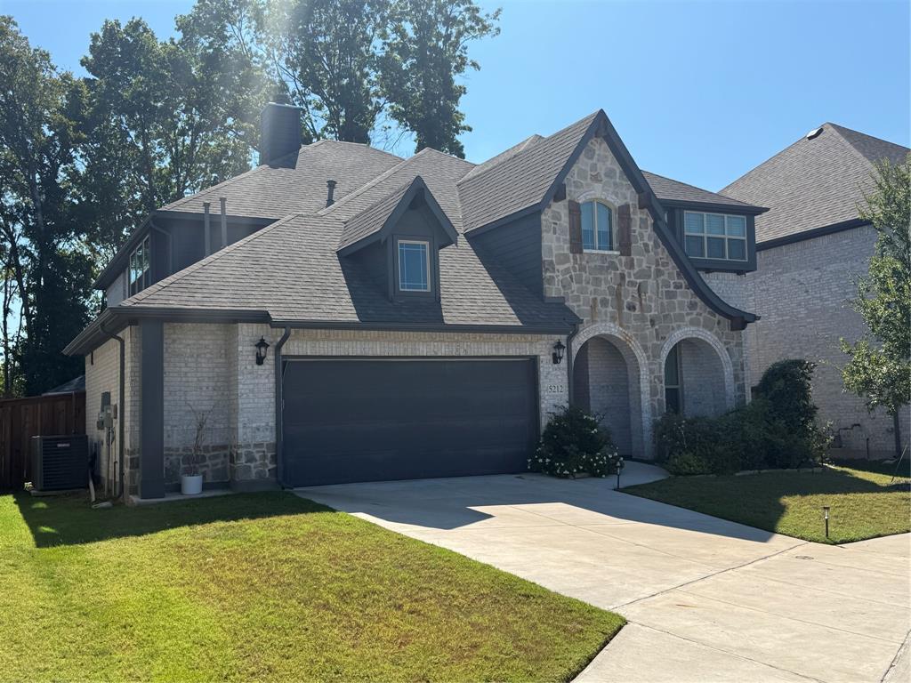 5212 Troupe Road McKinney, TX 75071 - Photo 1 of 40 a front view of a house with garden