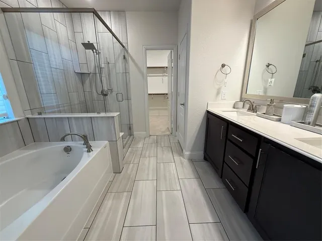 a view of room with window and wooden floor