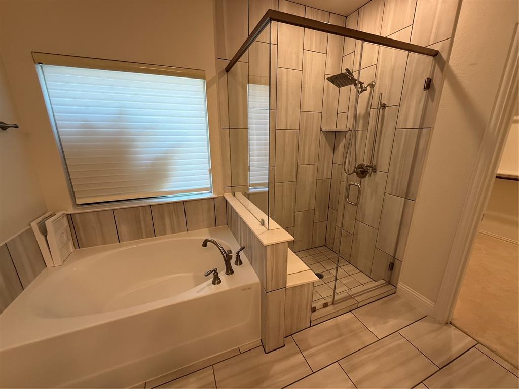 5212 Troupe Road McKinney, TX 75071 - Photo 14 of 40 a bathroom with a bathtub and shower