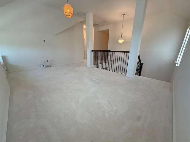 a view of a hallway with stairs