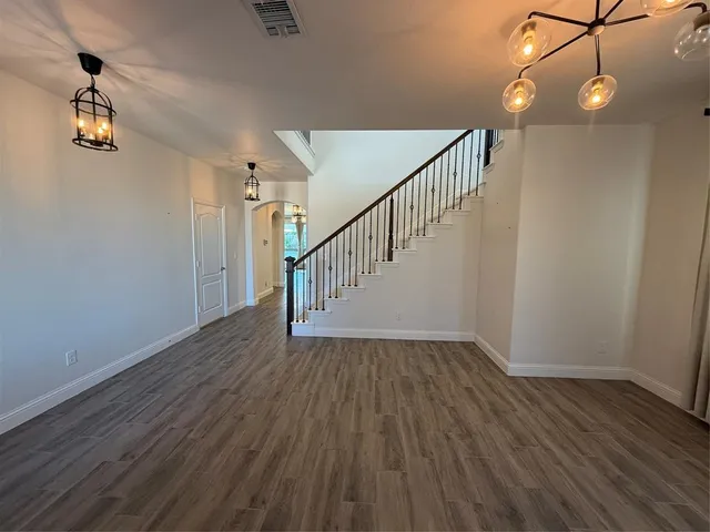 a view of room with wooden floor