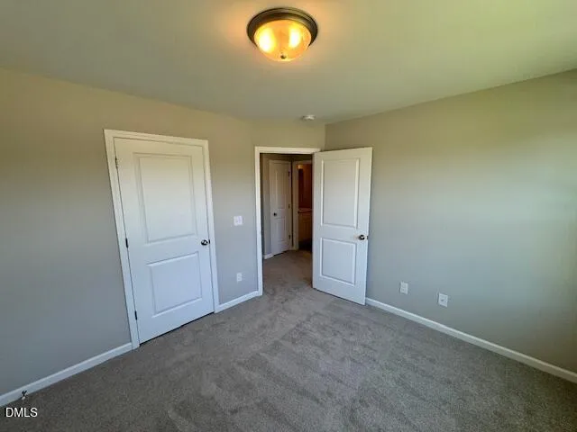 a view of an empty room and a window