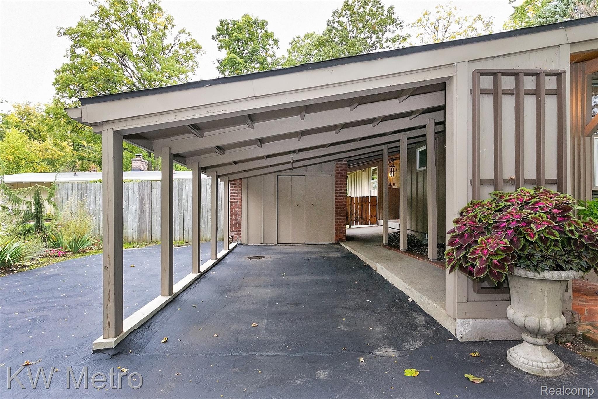 3216 West Webster Road Royal Oak, MI 48073 - Photo 28 of 35 Even the carport has great vaulted ceilings, keeping with the mid-century modern design.