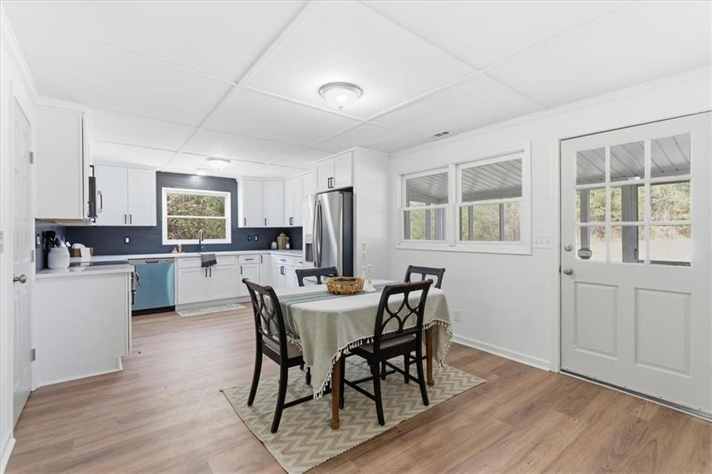 344 Colbert Road Dallas, GA 30132 - Photo 13 of 29 a view of a dining room with furniture and wooden floor