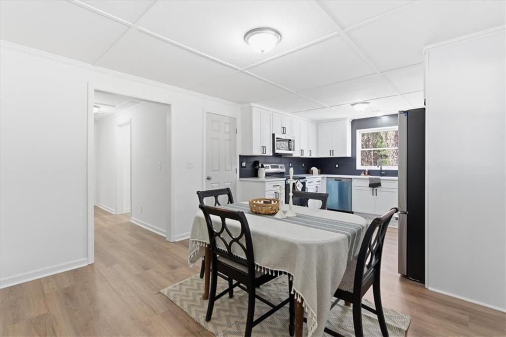 344 Colbert Road Dallas, GA 30132 - Photo 14 of 29 a dining room with furniture and window