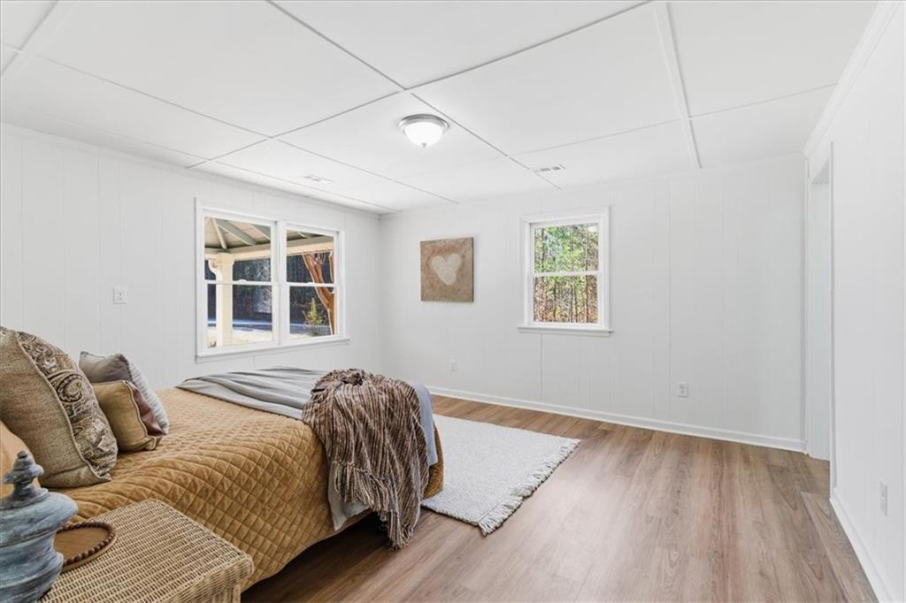 344 Colbert Road Dallas, GA 30132 - Photo 16 of 29 a bedroom with a bed and wooden floor