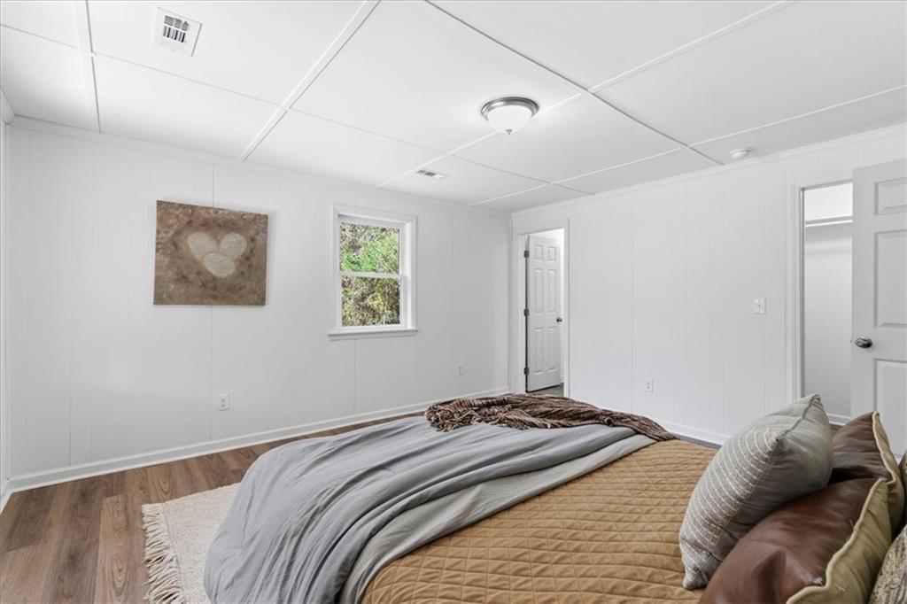344 Colbert Road Dallas, GA 30132 - Photo 18 of 29 a bedroom with a bed and a window