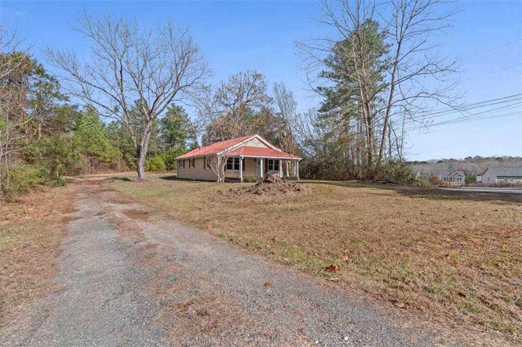 344 Colbert Road Dallas, GA 30132 - Photo 2 of 29 a front view of house with yard and lake view