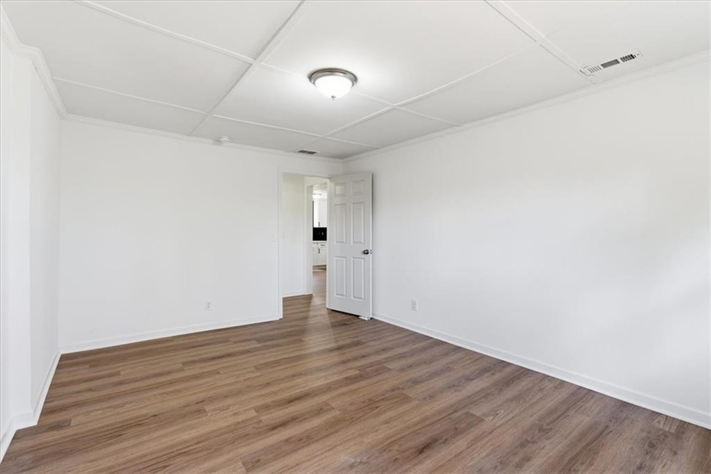 344 Colbert Road Dallas, GA 30132 - Photo 21 of 29 a view of an empty room with wooden floor
