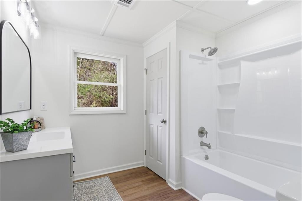 344 Colbert Road Dallas, GA 30132 - Photo 23 of 29 a bathroom with a tub shower sink and mirror