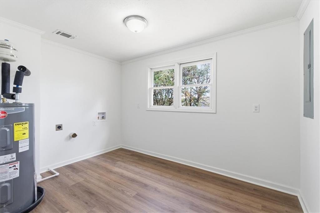 344 Colbert Road Dallas, GA 30132 - Photo 24 of 29 an empty room with wooden floor and window
