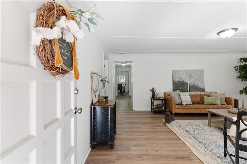 344 Colbert Road Dallas, GA 30132 - Photo 4 of 29 a living room with furniture and a wooden floor