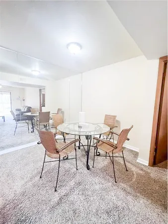 a patio with a table and chairs