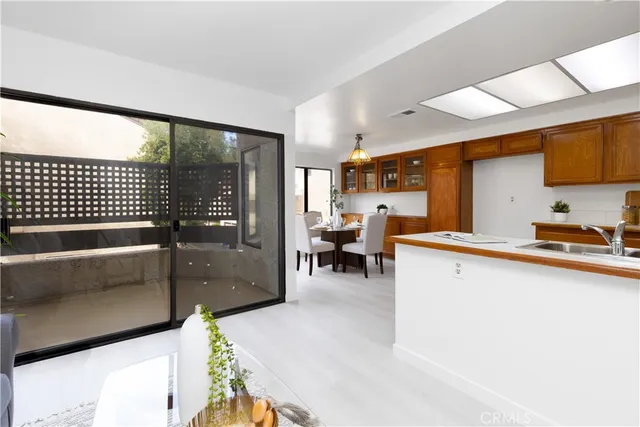 a kitchen with a sink cabinets and appliances