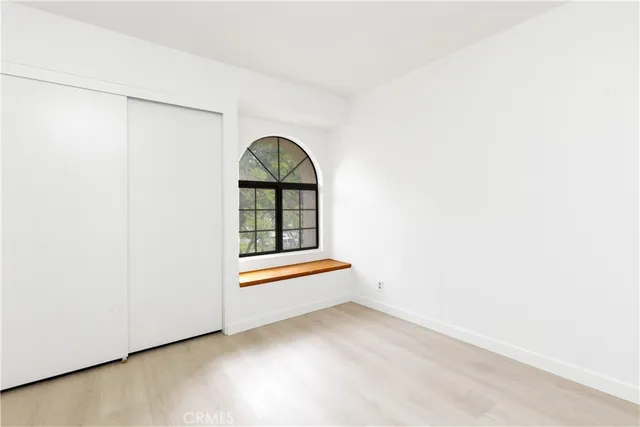 a view of empty room with air conditioner and window