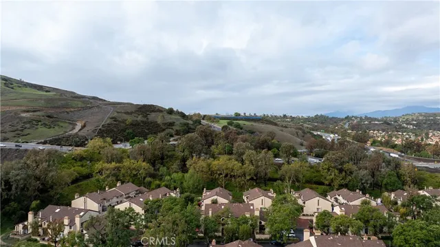an aerial view of a house with mountain view