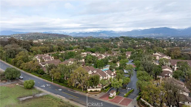an aerial view of residential house with green space