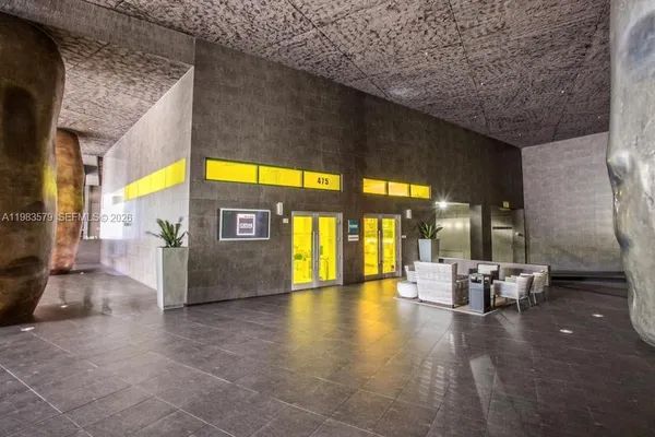 a view of lobby with furniture and a floor to ceiling window