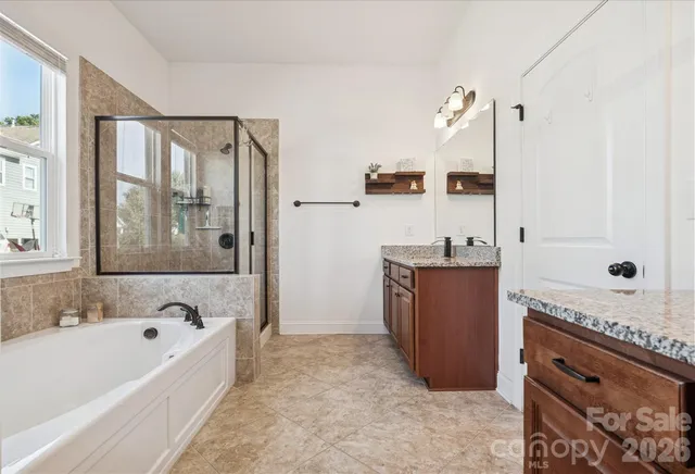 a bedroom with furniture and a ceiling fan