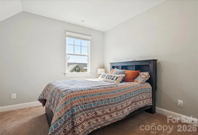 a view of a house with pool and chairs