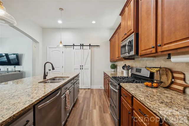a kitchen with center island table and chairs