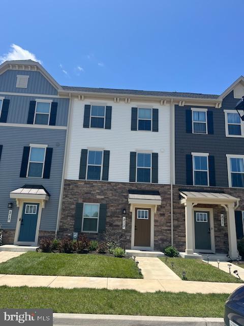 213 Lyons Creek Drive Laurel, MD 20708 - Photo 2 of 18 a front view of a house with yard