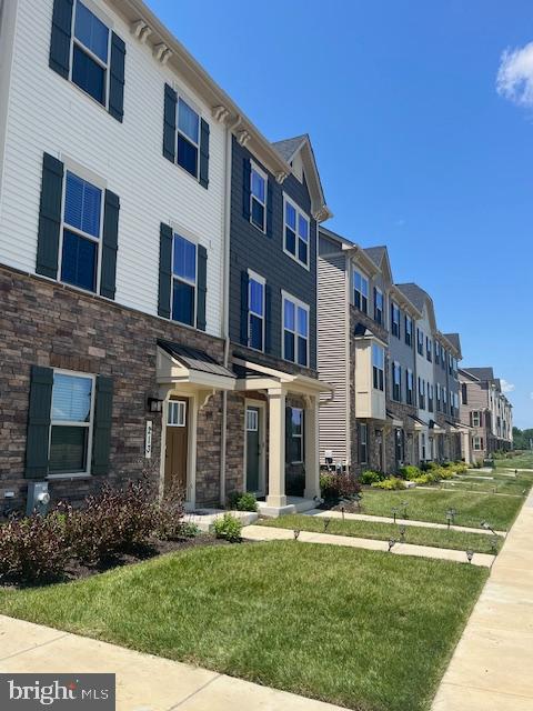 213 Lyons Creek Drive Laurel, MD 20708 - Photo 3 of 18 a view of a building with a yard