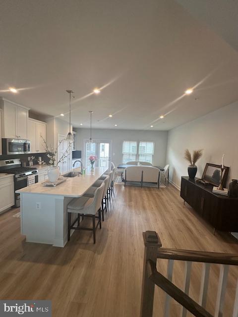 213 Lyons Creek Drive Laurel, MD 20708 - Photo 5 of 18 a living room with furniture and a table