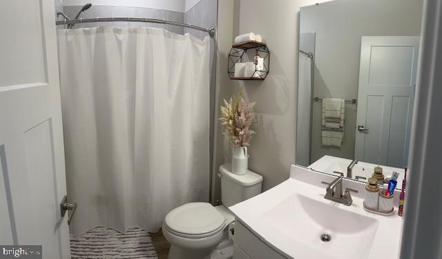 213 Lyons Creek Drive Laurel, MD 20708 - Photo 7 of 18 a bathroom with a sink toilet and shower