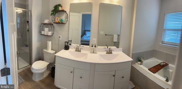 213 Lyons Creek Drive Laurel, MD 20708 - Photo 8 of 18 a bathroom with a sink a toilet and shower