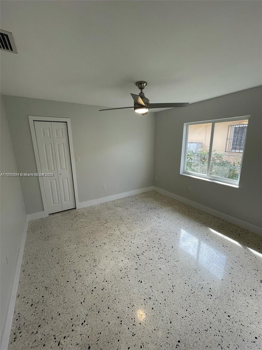 3518 Southwest 24th Terrace, Unit 3518 Miami, FL 33145 - Photo 11 of 11 an empty room with windows and closet