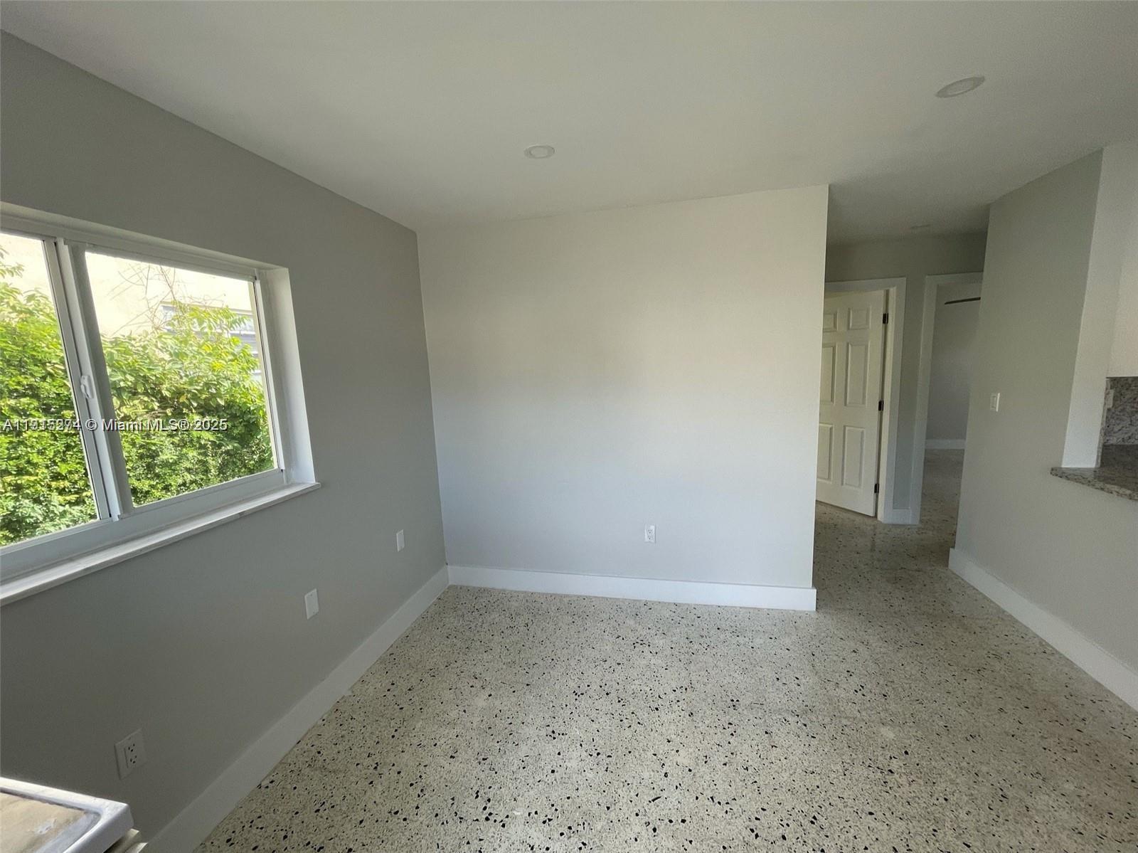 3518 Southwest 24th Terrace, Unit 3518 Miami, FL 33145 - Photo 4 of 11 a view of an empty room with a window