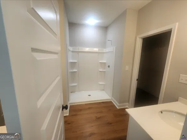 a bathroom with a sink and shower