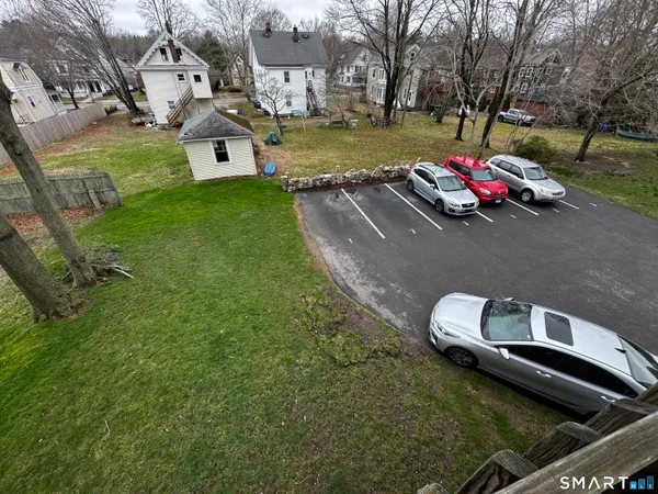 an aerial view of a house with garden space and street view