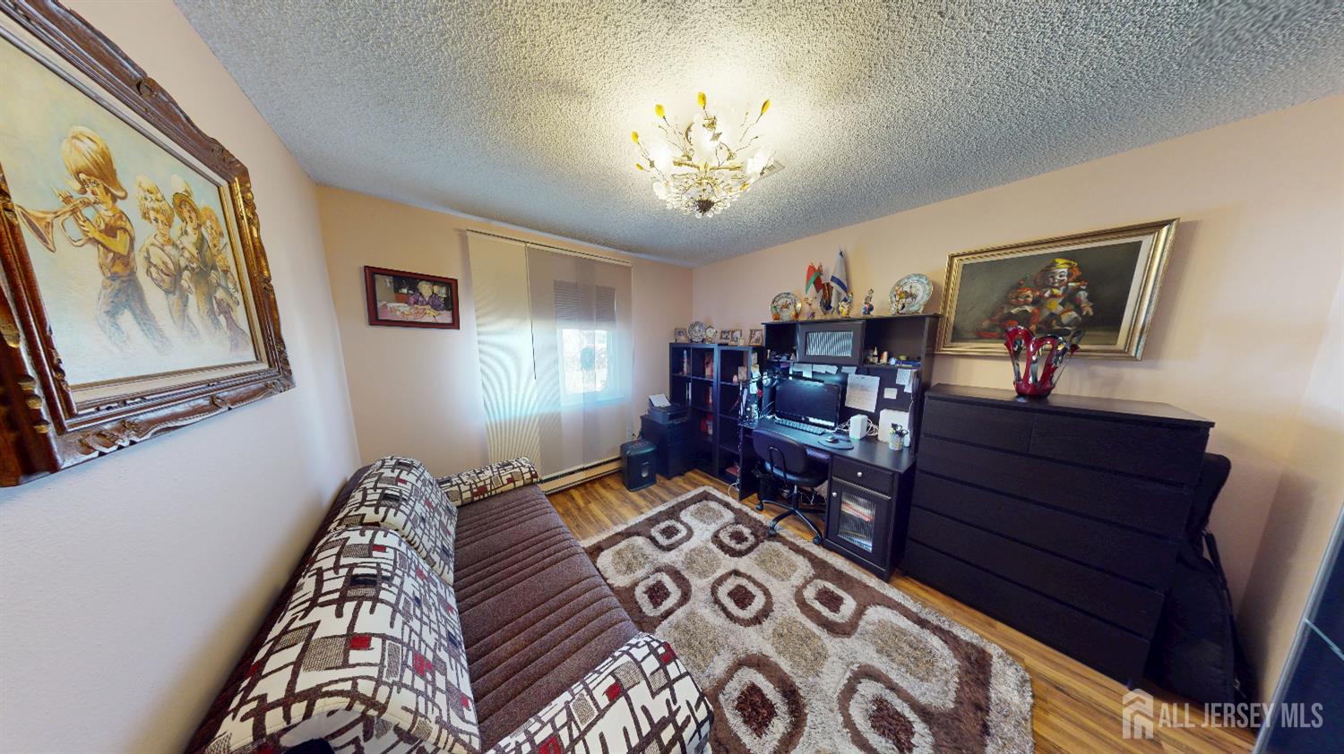 452A Closter Road, Unit B Monroe Township, NJ 08831 - Photo 13 of 46 a bedroom with furniture and a chandelier