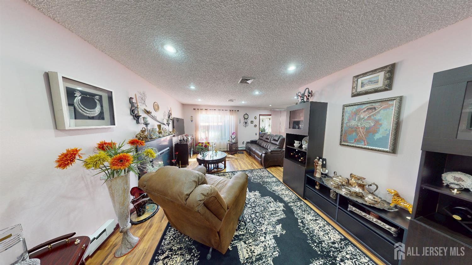 452A Closter Road, Unit B Monroe Township, NJ 08831 - Photo 17 of 46 a living room with furniture and a flat screen tv