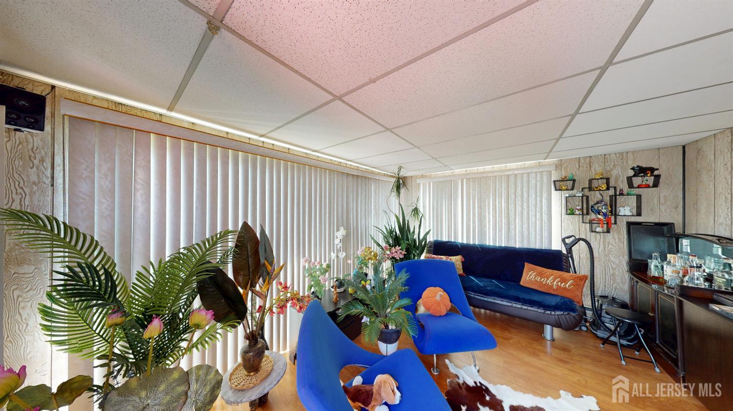 452A Closter Road, Unit B Monroe Township, NJ 08831 - Photo 21 of 46 a living room filled with furniture and a potted plant